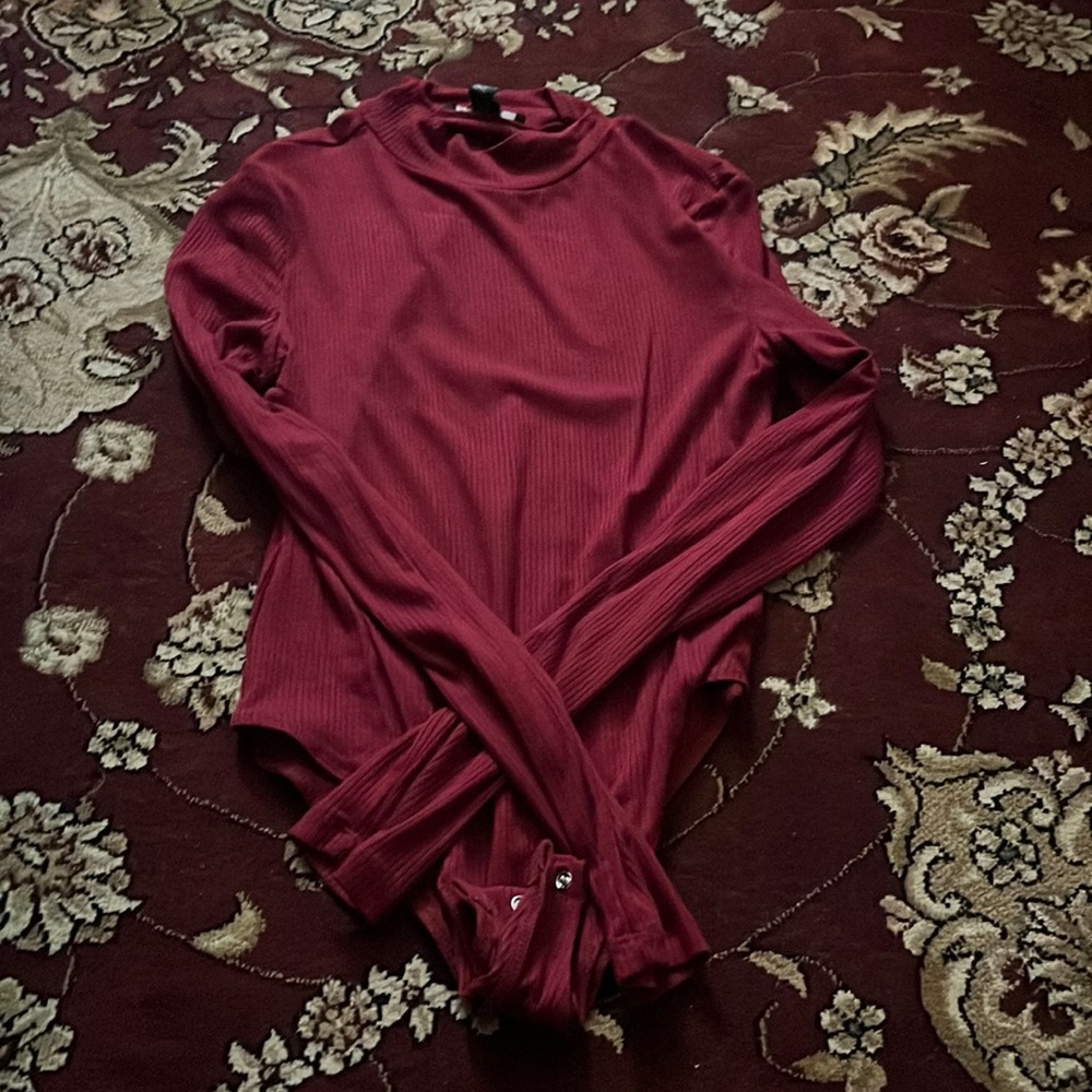 Nice fitting/flattering burgundy body suit from forever 21 in a size medium.